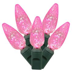 pink led christmas lights on black wire with green tips and clear bulbs, isolated against a white background