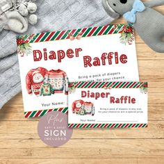 two diaper raffle coupons sitting on top of a wooden table next to a teddy bear