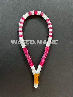 pink and white beaded lanyard with an orange hook