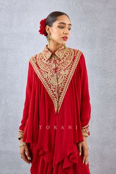 Editor's Note Featuring a bright red heavy golden embroidered yoke shirt having gathers along with embroidered dori in silk crepe Color: Red Fabric: Silk crepe Components: Shirt and dhoti Embroidery details: Hand embroidery, dori and hand adda work Fit: Relaxed Occasion: Festive and wedding guest Care: Dry Clean Only About the Designer Torani by Karan Torani stands handcrafted luxury inspired by the myriad tales of Indian mythology. Torani is a potpourri of all things nostalgic that binds you wi Long Kurti Patterns, Dhoti Skirt, Yoke Shirt, Salwar Kamiz, Simple Pakistani Dresses, Stylish Party Dresses, Fancy Dress Design, Fashionista Clothes, Pattern Embroidery