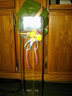 a glass vase with some flowers in it