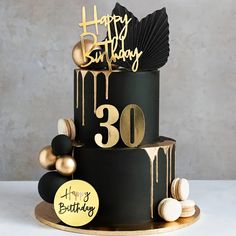 a black and gold birthday cake with the number 30 on it's tiering