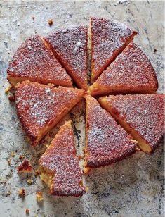 a sliced up cake sitting on top of a table