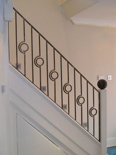 an open door is on the side of a stair case