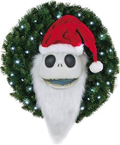 a christmas wreath with a skeleton wearing a santa claus hat on it's head