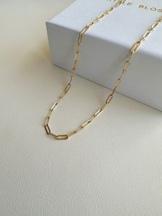 "Dainty Gold Filled paper clip chain necklace.    --------------------------------------------- >>  Length: 40cm or 45cm >>  Material: 14k gold filled   >>  Chain Dimensions: 2.5mm x 6.5mm >>  Hypoallergenic,nickel free,sensitive skin friendly&tarnish resistant. ------------------What is gold filled ------------------ Most of our findings and wires are made with 14k gold filled.\"Gold-filled\" is a USA industry standard that legally requires 5% pure gold by weight. It is a solid layer of gold bonded to another metal through heat and pressure. It does not wear off or turn colours over time, and if taken care of properly it can last a lifetime.Gold-filled jewellery is a cheaper, yet the best alternative to solid gold. It's hypoallergenic and water-safe." Minimalist Paperclip Chain Necklace As Gift, Minimalist Paperclip Chain Necklace For Gift, Minimalist Paperclip Chain Necklace Gift, Gold Paperclip Chain Necklace With Box Chain, Gold Chain Paperclip Necklace For Gifts, Paperclip Chain Necklace As A Gift, Classic Paperclip Chain Necklace As Gift, Gold Paperclip Chain Necklace As Gift, Gift Paperclip Chain Necklace