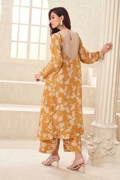 Gold kurta with floral print, floral applique and coin sequin embroidered yoke. Paired with a cuff print pant. - Aza Fashions Spring Wedding Kurta With Floral Print, Spring Wedding Printed Salwar Kameez, Floral Print Spring Kurta For Wedding, Fitted Floral Print Palazzo Set For Spring, Spring Anarkali Palazzo Set With Floral Print, Spring Floral Print Georgette Salwar Kameez, Fitted Floral Print Palazzo Set For Eid, Fitted Long Sleeve Palazzo Set With Floral Print, Fitted Straight Kurta Palazzo Set With Floral Print