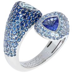 Aquamarine Tanzanite Blue Sapphires White 18 Karat Gold Riviera Ring The name and the variety of colours in this collection are associated with the bright Italian and French Riviera, vivid and colourful houses and sun reflections on the water. A place where grow cypresses, palm trees and chestnuts, where there are many gardens, parks and vineyards. Many works by Auguste Renoir, Henri Matisse, Paul Signac were made in these places. Inspired by these beauties, we present you the Riviera collection Paul Signac, Unique Ring Designs, Sapphire Cocktail Ring, Auguste Renoir, Tanzanite Jewelry, Contemporary Ring, Blue Sapphire Diamond, Diamond Cocktail Rings, White Gold Diamond Rings