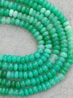 three strands of green glass beads