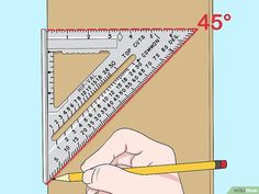 a person holding a ruler and pencil in their hand