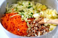 carrots, celery, and other vegetables are mixed together in a bowl