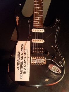 an electric guitar is on display at the museum