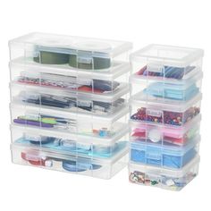 three clear storage containers with various items in them