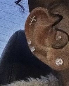 a person with ear piercings on their ears