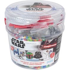 a plastic container filled with assorted legos and star wars items on top of a white background