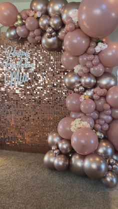 balloons and confetti are arranged on the floor