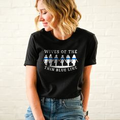 Show your support for a loved one who has sworn an oath to protect and serve with the Wives of The Thin Blue Line T-Shirt. Whether for the Wife whose husband is a police officer, or a Wife who has a career in law enforcement, this t-shirt is the perfect choice as the perfect gift. Blue Line, Law Enforcement, Police Officer, Career, Perfect Gift, T Shirts For Women, Christmas, Women's Top, T Shirt