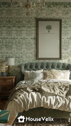 a bedroom with green and white wallpaper has a large bed in the middle, along with a chandelier above it