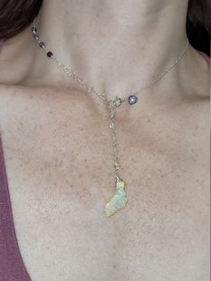 Ethiopian opal, Herkimer diamond & iolite choker. Perfect for summer as this stone looks like it has glitter inside. The glitter effect is visible in sunlight and especially indirect/indoor light. The opal also happens to be shaped like Florida 🙂 The choker is 14.5 inches with a 3 inch drop. It clasps in the front where there is a small iolite accent. The opal is hanging below a chain of Herkimer diamonds that extends up the chain and transitions to iolite. Opals are very difficult to photo Adjustable Opal Birthstone Jewelry, Ethiopian Opal Gemstone Jewelry, Elegant Ethiopian Opal Jewelry With Natural Stones, Unique Iridescent Opal Jewelry, Teardrop Ethiopian Opal Jewelry Gift, Ethiopian Opal Birthstone Necklace For Gift, Dainty Ethiopian Opal Birthstone Jewelry, Spiritual Opal Jewelry As A Gift, Elegant Iridescent Birthstone Jewelry