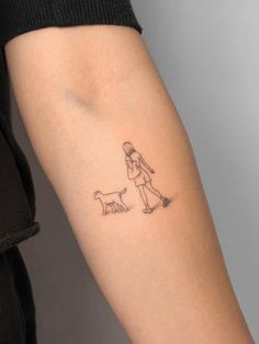 a woman with a dog tattoo on her arm