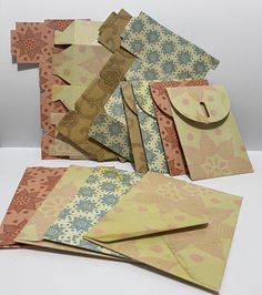 there are many different types of cards on the table with each one's own envelope