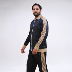 Tracksuits have been a part of popular culture for decades. 2-piece matching suits are worm from the GYM to the sports field and from work to casual weekend activities. The new series tree tracksuit comes in a two color combination in a traditional style and standard fit, which makes it a great fit at any age. The track jacket is composed of a seamlessly comfortable track material for daily wear. The slim fit track pants ensure a contemporary and fashionable jogger style.About this item1.Standard fit tracksuit runs true to size2.Full zip up track jacket with zippered side pockets and stand collar3.Track pants with 2 zippered side pockets, adjustable waist with drawstrings and adjustable drawstrings at ankle4. 60% Cotton 40% Polyester5. Machine Wash, Machine Dry Product detailsFabric type: Black Long Sleeve Moisture-wicking Tracksuit, Black Moisture-wicking Long Sleeve Tracksuit, Casual Black Track Jacket For Jogging, Casual Winter Tracksuit For Sports Events, Black Sportswear Tracksuit For Sports Events, Black Tracksuit For Sports Events, Casual Tracksuit For Sports Events, Black Long Sleeve Tracksuit For Training, Fitted Black Tracksuit With Moisture-wicking