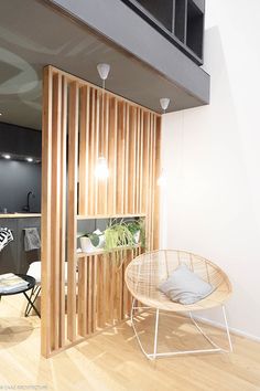 a living room with wooden slats on the wall