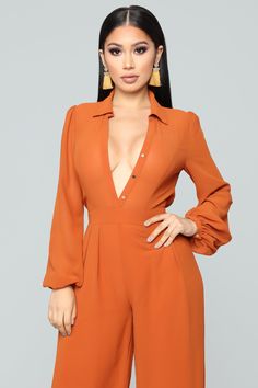 Available In Cognac Long Sleeve Button Front Lined Plus Only: Runs Small, Shop One Size Up Self/Lining: 100% Polyester Imported | Like Me Better Jumpsuit in Cognac Brown size XL by Fashion Nova Elegant Fitted Orange Jumpsuits And Rompers, Orange Fitted Elegant Jumpsuit, Elegant Fitted Orange Jumpsuit, Chic Collared Jumpsuits And Rompers, Fitted Jumpsuit And Romper With Button Closure And V-neck, Fitted Jumpsuit With Button Closure And V-neck, Elegant Solid Color Button-up Jumpsuit, Fitted V-neck Jumpsuit With Button Closure, Chic Jumpsuits And Rompers With Buttons For Fall