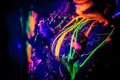 the woman is covered in neon paint