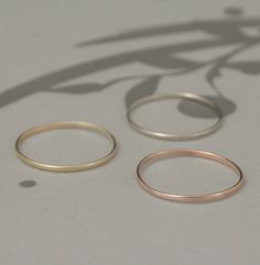 This thin little band is so pretty! Hand forged from 1mm wide solid 14K gold half round stock, it's petite and perfect in every way! The finished ring measures just under 1mm wide by .5mm thick. It will be custom made just for you in your size and given a high polished finish. If you would prefer a brushed/matte finish instead, please just leave your request in the note to seller box provided during checkout. Blazer Arts is a family-owned and operated small but growing business that first opened Plain Jane, Opal Ring Gold, Palm Coast, Gold Ring Stack, Rose Yellow, White Gold Band, Vintage Band, Stacking Ring, Wedding Rings For Women