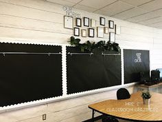 a blackboard with white scalloped edges is hanging on the wall in an office