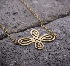 "Celtic knot in its many Variations, symbolizes eternity whether this means faith, loyalty, friendship or love. This is the perfect gift to Show your loved ones how much you appreciate them. ♥WANT TO MAKE IT PERSONAL? ♥ Add a charm letter to your necklace - Add this item: https://www.etsy.com/il-en/listing/687931684 ★ Comes in our signature box, ready for gift giving. ★ Available in Gold [18K goldfield & gold plated brass ] ★ Available in Silver [sterling silver & silver plated brass ] ★ Gold Necklaces With Butterfly Knot For Gift, Gold Butterfly Knot Necklace For Gift, Gold Necklace With Butterfly Knot For Gift, Gold Butterfly Knot Jewelry For Gift, Gold Jewelry With Butterfly Knot For Gift, Gold Infinity Necklace For Gift, Irish Necklace, Loyalty Friendship, Infinity Necklace Gold