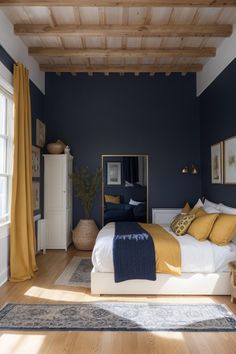 a bedroom with dark blue walls and yellow bedding in the corner, along with wooden flooring