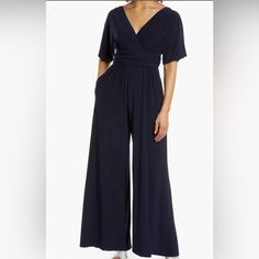 This Beautiful Jumpsuit Is Perfect For Cocktail Hour, Travel, Or An Evening Event. The Short Dolman Sleeves, Wide Flowy Legs And Deep V Are Super Flattering. Stretch Jersey. And Let’s Not Forget To Mention She Has Pockets! **Never Been Worn. Color: Beautiful Deep Ink/Navy Size: (8) 53 1/2" Length (Size 8) Surplice V-Neck Short Sleeves 95% Polyester, 5% Spandex Machine Wash, Tumble Dry Item #7097791 Beautiful Jumpsuits, Eliza J, Wide Leg Jumpsuit, Cocktail Hour, Dolman Sleeve, Pant Jumpsuit, Jumpsuit Romper, Wide Leg, Jumpsuit