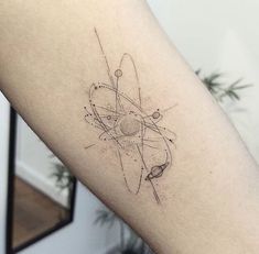 a black and white photo of a tattoo on the arm with an image of a star