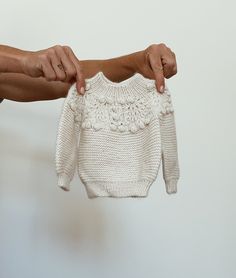 Welcoming Winnie into the fold. Our Winnie sweater is lovingly hand knit in the softest baby alpaca - perfect for your little ones precious skin. Our Winnie sweater is our modern take on a vintage matinee gown. The garter stitch compliments the yoke detailing by balancing the overall look, resulting in a timeless, gender neutral design. Pop Winnie on with your Fern pants and pair with our Barbara bonnet and Dudley booties for the ultimate in winter warmth.