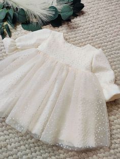 ♡ MADE OF: Ecru fabric with layersnof beige tulle. The lining is made of 100% cotton ♡ Processing time is usually 5-7 days.  ♡ CARE INSTRUCTIONS: Wash in cold or warm water (30oC/ 65 - 85F). Do not use bleach. Dry at low temperatures, do not use machine drying. Iron at medium or low temperature. Hand wash and hang dry for longer wear. Elegant Cream Tulle Princess Dress, Elegant Cream Tulle Gown, Fitted Tulle Baptism Dress For Party, White Organza Tutu Dress For Baptism, Elegant Cream Princess Dress With Tulle Skirt, White Organza Tutu Dress, Beige Tulle Skirt Wedding Dress, Elegant Cream Tutu Dress For Wedding, Fitted Cream Princess Baptism Dress