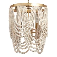 a chandelier with white beads hanging from the ceiling