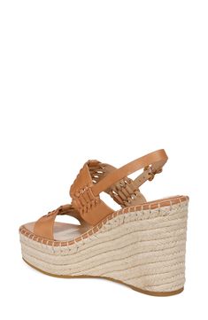 Interwoven leather straps lend visual intrigue to an espadrille-inspired slingback sandal lifted by a jute-wrapped platform and soaring wedge heel. 4 1/4" heel; 1 3/4" platform (size 8.5) Adjustable slingback strap with buckle closure Leather upper and lining/rubber sole Imported Leather Wedge Sandals With Woven Sole For Vacation, Platform Wedge Sandals For Vacation, Natural Color Wedge Heel Sandals With Heel Strap, Platform Slingback Wedge Sandals For Beach, Leather Wedge Sandals With Braided Straps For Beach, Leather Wedge Sandals With Braided Straps For Vacation, Beige Leather Wedge Sandals For Beach, Summer Leather Slingback Sandals With Woven Sole, Chic Wedge Heel Slingback Sandals For Beach