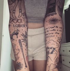 two people with tattoos on their arms and legs