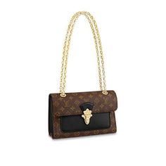 The Victoire chain bag pairs Monogram canvas with smooth colored leather for a sophisticated day-to-evening accessory. The golden clasp is modeled on the lock of classic Louis Vuitton luggage, while the sliding chain strap echoes the Malletage print that lined those historic trunks. Large enough to fit a long wallet, the bag can be worn cross-body or short-shoulder style. Detailed Features 10.2 x 6.9 x 3.7 inches(length x Height x Width) Black Monogram coated canvas and cowhide leather Smooth cowhide-leather trim Microfiber lining Gold-color hardware Metal clasp closure Outside pocket 2 compartments Inside zipped flat pocket Chain:Sliding, not removable Chain drop: 11.8 inches Chain drop max: 22.0 inches The reference is either made in France, Spain, Italy or in the US. Note: Our Items are Lv Luggage, Stile Casual Chic, Louis Vuitton Luggage, Evening Accessories, Monogram Handbag, Lv Bags, Lv Handbags, Monogram Bag, Canvas Handbags