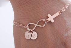 High Quality Rose Gold Filled, Gold Filled,Sterling Silver chain Infinity Bracelet. Initials Rose Gold Bracelet. Infinity Cross Bracelet Infinity Rose Gold Bracelet.  Length is adjustable from 6 1/2 to 7 1/4 inches.  *chain:rose gold filled *disc:High quality  rose gold filled , hand stamp initial *Infinity charm - High quality   rose gold  plated  (21*8.5 mm)  *Item comes packaged in a gift box. *Tracking # will be given to all orders.  *Please check out the other jewelry in my shop: https://www.etsy.com/shop/dorocy *If you have any questions, feel free to ask me! Pink Infinity Jewelry For Gifts, Infinity Rose Gold Bracelet For Mother's Day, Rose Gold Infinity Bracelet For Mother's Day, Pink Infinity Jewelry For Anniversary, Personalized Infinity Rose Gold Jewelry, Adjustable Rose Gold Charm Bracelet For Anniversary, Personalized Rose Gold Charm Bracelet For Wedding, Personalized Rose Gold Infinity Jewelry, Elegant Nickel-free Bracelet For Birthday Gift