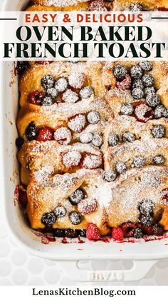 an easy and delicious oven baked french toast with fresh berries in the middle, topped with powdered sugar