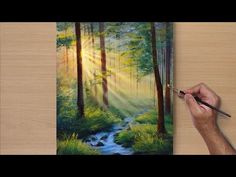 someone is painting a forest scene with sunlight coming through the trees