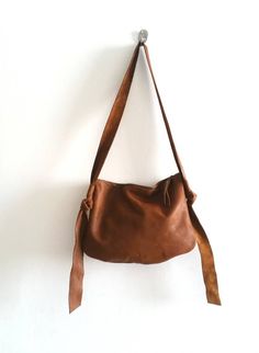 Brown leather bag, cross bady bagCool and simple bag . it may look small , but this bag is roomy enough for your goodies .A long strap is threaded into a loop at the end  knot, so you can adjust the length as you need ( across the body or over the shoulder)* 100% Genuine Leather* metal zipper* long adjust strap * small open pocket inside* flat figer* NO linningDimensions:Width 12 inches, 30 cmHeight 9.5 inches, 24 cm####### To keep the leather from dirt you can use Anti-dirt spray for leather an Brown Bags With Long Strap For Everyday, Brown Bag With Long Strap For Everyday, Brown Satchel With Long Strap For Daily Use, Brown Shoulder Bag With Long Strap For On-the-go, Brown Everyday Bag With Long Strap, Brown Long Strap Shoulder Bag For On-the-go, Everyday Brown Bag With Long Strap, Everyday Brown Satchel With Long Strap, Brown Hobo Bag With Long Strap Crossbody