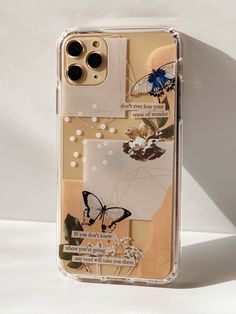 an iphone case with flowers and butterflies on the back, sitting on a white surface