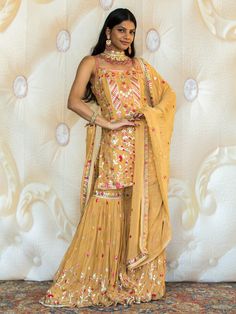 Introducing the Sakshi Sharara - the epitome of elegance and style. This exquisite women's suit is perfect for all your special occasions and ceremonies. With its fusion of Indian and Western elements, it is a true reflection of modern fashion. Key Features: Color: Five Star Yellow Designed for women Perfect for events and ceremonies Indo-Western fusion Beautifully crafted High-quality fabric Make a statement with the Sakshi Sharara. Its vibrant Five Star Yellow color will make you stand out fro Buy Lehenga Online, Western Elements, Indian Bridal Couture, Star Yellow, Elegant Veils, Reception Gowns, Mehendi Outfits, Fusion Design, Bridal Lehenga Red