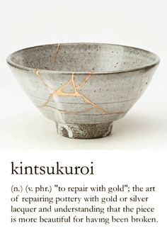 a bowl with some writing on it and the words kintsuukroki written in english