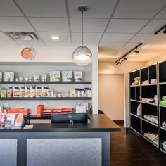 the inside of a store with shelves filled with items