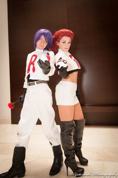 two women dressed in cosplay clothes posing for the camera